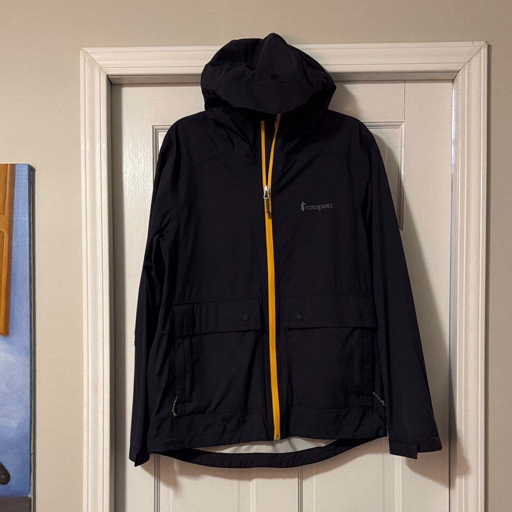 Cotopaxi Men's Dark Blue Raincoat with Yellow Zipper